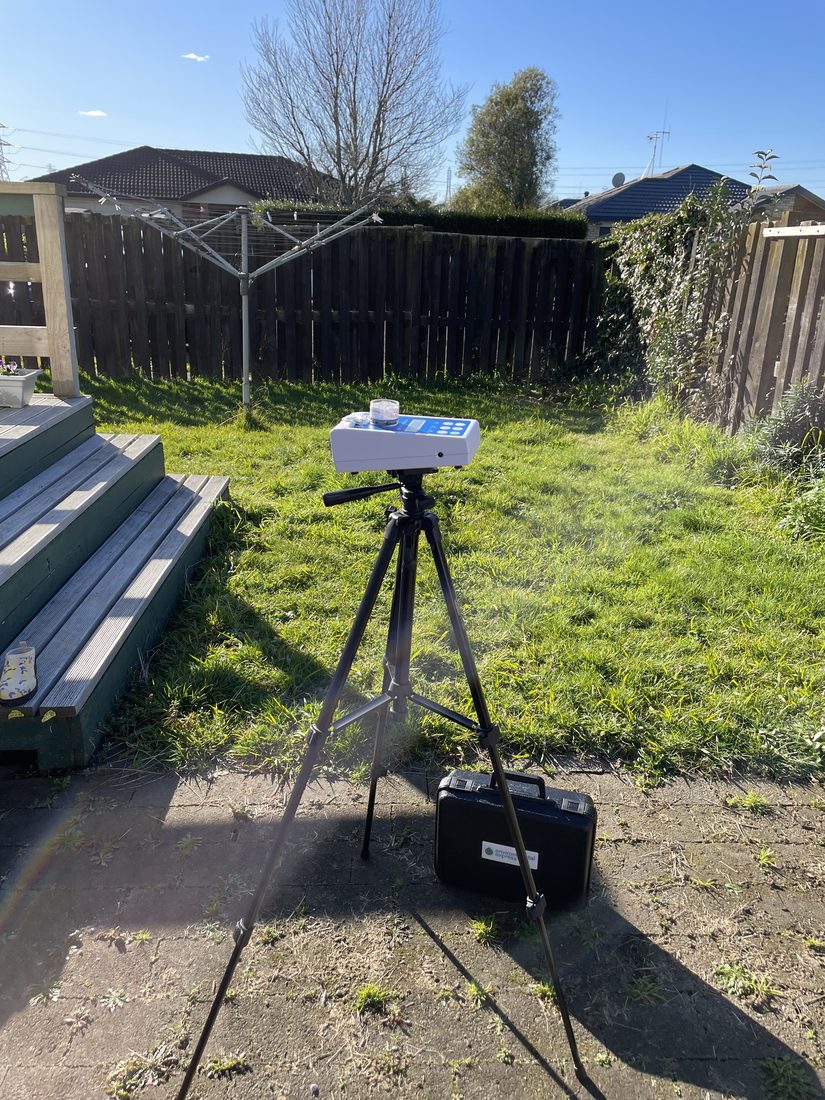 An outdoor reference air sample being collected on a calibrated spore trap in a property's backyard, taken on the same day as the indoor samples